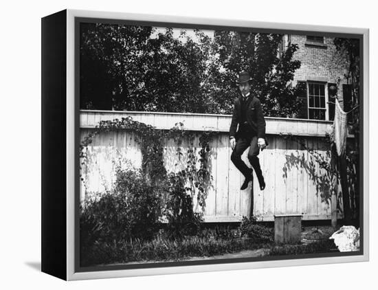Man in a Suit and Bowler Hat Jumping in the Air in a Backyard in Brooklyn, Ny-Wallace G^ Levison-Framed Premier Image Canvas