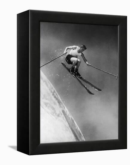 Man in a Vest in Mid-Air as He Skis Down a Steep Mountain-null-Framed Premier Image Canvas