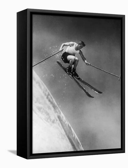 Man in a Vest in Mid-Air as He Skis Down a Steep Mountain-null-Framed Premier Image Canvas