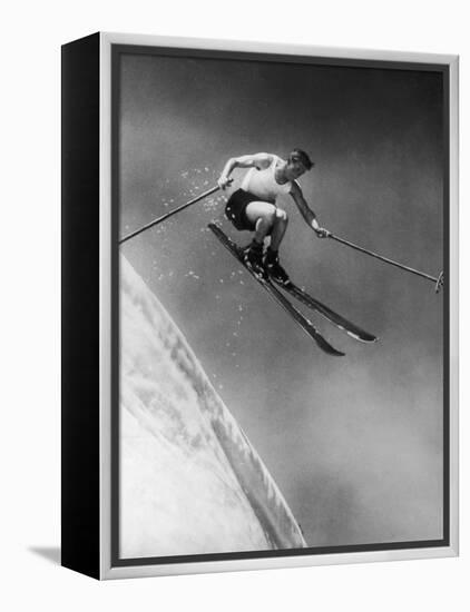 Man in a Vest in Mid-Air as He Skis Down a Steep Mountain-null-Framed Premier Image Canvas