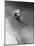 Man in a Vest in Mid-Air as He Skis Down a Steep Mountain-null-Mounted Photographic Print