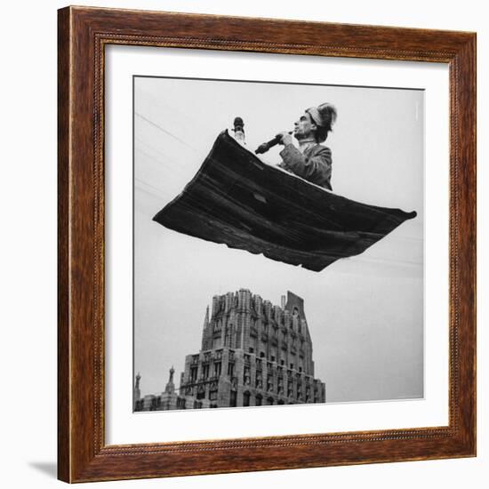 Man in Arabic Dress, Smoking a Water Cooled Pipe, is Comfortably Sitting on a Magic Carpet-Andreas Feininger-Framed Photographic Print