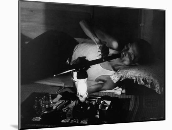 Man in Opium Den-John Dominis-Mounted Photographic Print