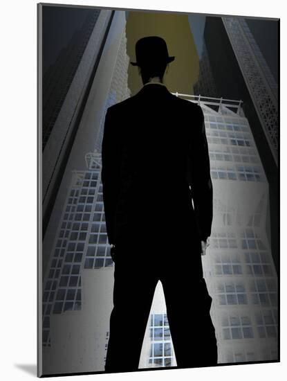 Man in Suit and Bowler Hat Standing in Front of Skyscraper-null-Mounted Photographic Print