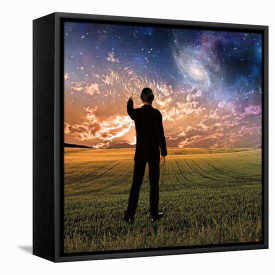 Man in Suit Touches Sky Creating Ripples-rolffimages-Framed Premier Image Canvas