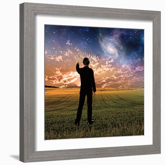 Man in Suit Touches Sky Creating Ripples-rolffimages-Framed Photographic Print