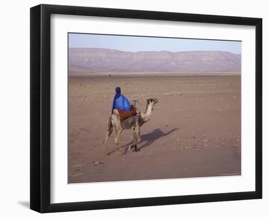 Man in Traditional Dress Riding Camel, Morocco-Merrill Images-Framed Photographic Print