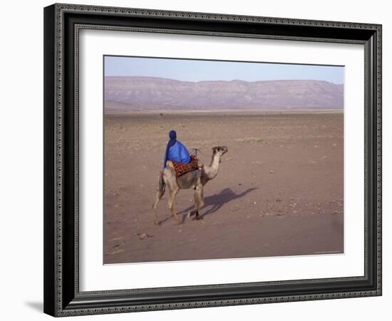 Man in Traditional Dress Riding Camel, Morocco-Merrill Images-Framed Photographic Print