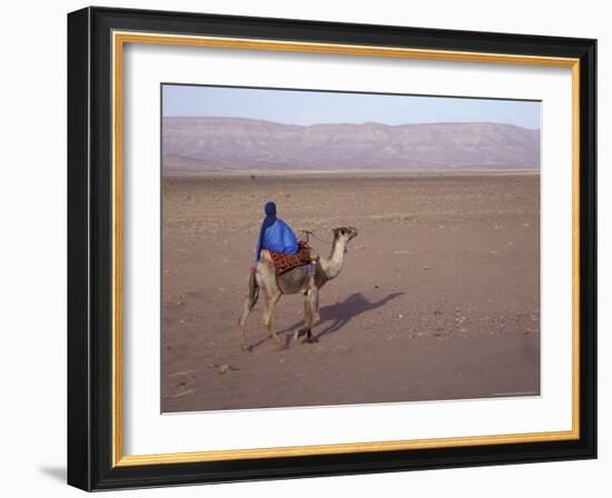 Man in Traditional Dress Riding Camel, Morocco-Merrill Images-Framed Photographic Print