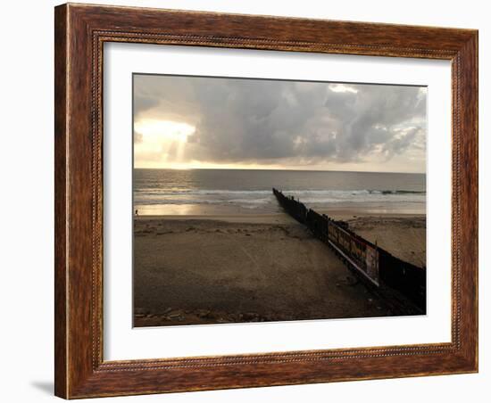 Man Jogs by the Beach Towards the Wall Dividing Mexico and the U.S. in Tijuana, Mexico-null-Framed Photographic Print