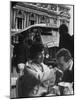 Man Kissing Woman's Hand at the Cafe de La Place de L'Opera-Loomis Dean-Mounted Photographic Print