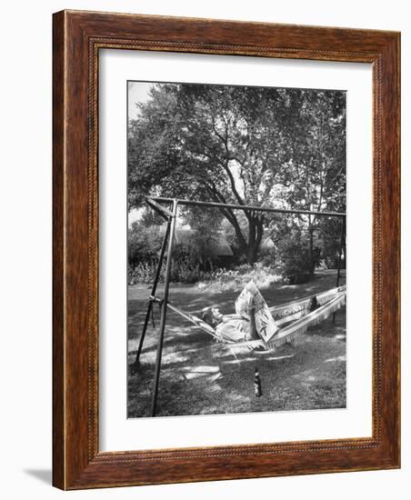 Man Laying in a Hammock with a Beer Beside Him-Frank Scherschel-Framed Photographic Print