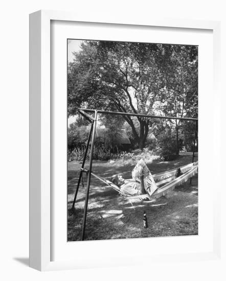 Man Laying in a Hammock with a Beer Beside Him-Frank Scherschel-Framed Photographic Print