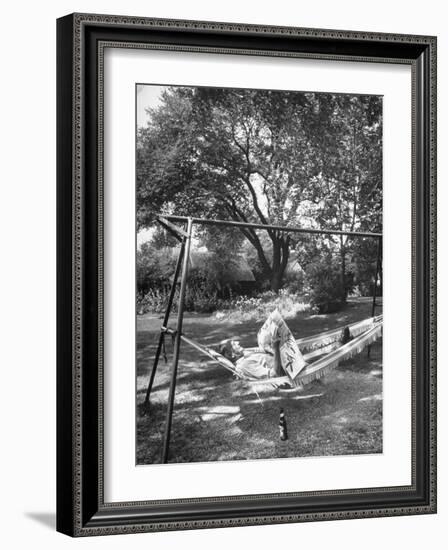 Man Laying in a Hammock with a Beer Beside Him-Frank Scherschel-Framed Photographic Print