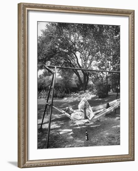 Man Laying in a Hammock with a Beer Beside Him-Frank Scherschel-Framed Photographic Print