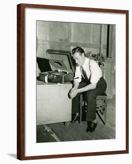 Man Listening to Portable Gramophone-null-Framed Photo