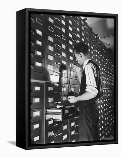 Man Looking at Film Records Containing Social Security Numbers at the Social Security Board-Thomas D^ Mcavoy-Framed Premier Image Canvas