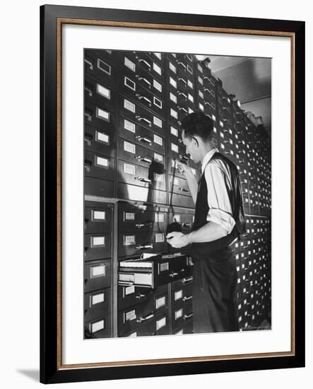 Man Looking at Film Records Containing Social Security Numbers at the Social Security Board-Thomas D^ Mcavoy-Framed Photographic Print