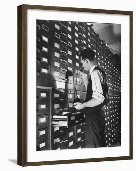 Man Looking at Film Records Containing Social Security Numbers at the Social Security Board-Thomas D^ Mcavoy-Framed Photographic Print
