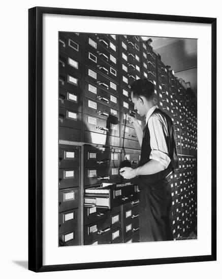 Man Looking at Film Records Containing Social Security Numbers at the Social Security Board-Thomas D^ Mcavoy-Framed Photographic Print