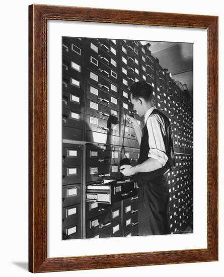 Man Looking at Film Records Containing Social Security Numbers at the Social Security Board-Thomas D^ Mcavoy-Framed Photographic Print