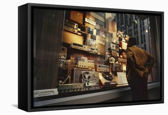 Man Looks at a Window Display of an Electronics Store, New York, New York, 1963-Yale Joel-Framed Premier Image Canvas