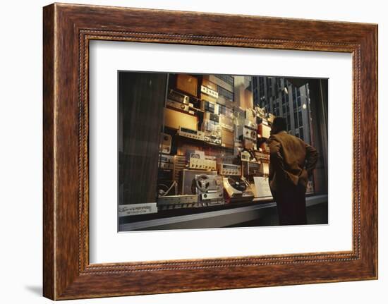 Man Looks at a Window Display of an Electronics Store, New York, New York, 1963-Yale Joel-Framed Photographic Print