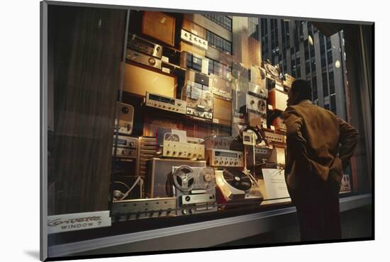 Man Looks at a Window Display of an Electronics Store, New York, New York, 1963-Yale Joel-Mounted Photographic Print