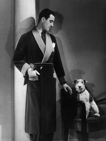 Man Models a Wool Jersey Dressing Gown and His Wire- Haired Fox Terrier  Poses for the Camera' Photographic Print | Art.com