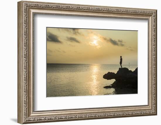 Man on a rock in backlight on the rocky west coast in Ouvea, Loyalty Islands, New Caledonia, Pacifi-Michael Runkel-Framed Photographic Print