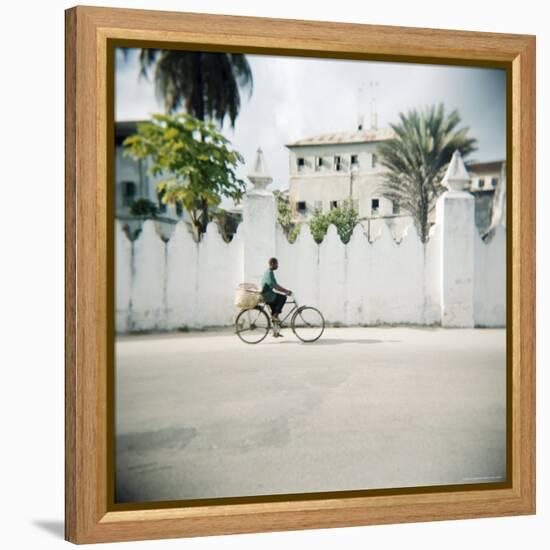 Man on Bicycle with Old Buildings Behind, Stone Town, Zanzibar, Tanzania, East Africa, Africa-Lee Frost-Framed Premier Image Canvas