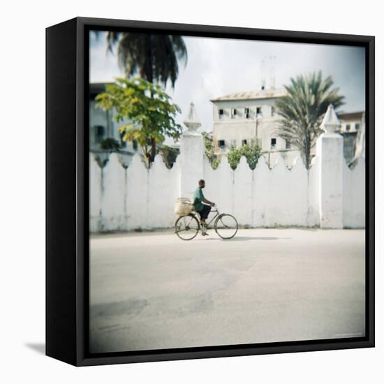 Man on Bicycle with Old Buildings Behind, Stone Town, Zanzibar, Tanzania, East Africa, Africa-Lee Frost-Framed Premier Image Canvas