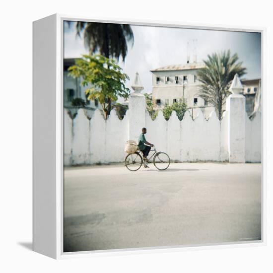 Man on Bicycle with Old Buildings Behind, Stone Town, Zanzibar, Tanzania, East Africa, Africa-Lee Frost-Framed Premier Image Canvas
