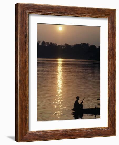 Man on Boat on River Near Dr. Albert Schweitzer's Compound at Lambarene-George Silk-Framed Photographic Print