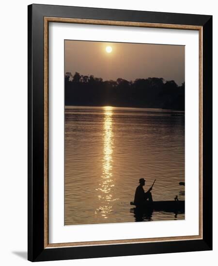 Man on Boat on River Near Dr. Albert Schweitzer's Compound at Lambarene-George Silk-Framed Photographic Print