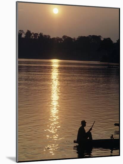 Man on Boat on River Near Dr. Albert Schweitzer's Compound at Lambarene-George Silk-Mounted Photographic Print