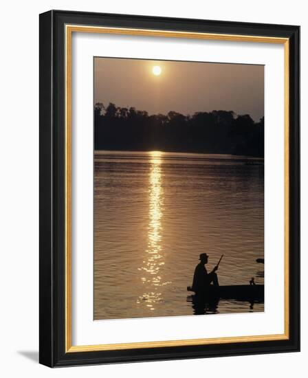 Man on Boat on River Near Dr. Albert Schweitzer's Compound at Lambarene-George Silk-Framed Photographic Print