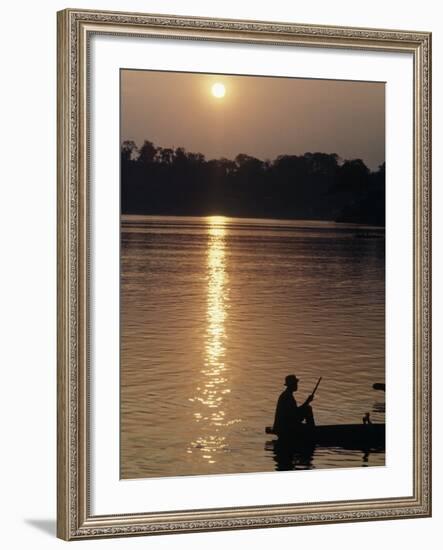 Man on Boat on River Near Dr. Albert Schweitzer's Compound at Lambarene-George Silk-Framed Photographic Print