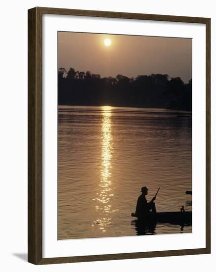 Man on Boat on River Near Dr. Albert Schweitzer's Compound at Lambarene-George Silk-Framed Photographic Print