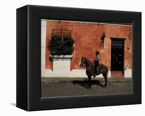 Man on Horse in Front of a Typical Painted Wall, Antigua, Guatemala, Central America-Upperhall-Framed Premier Image Canvas