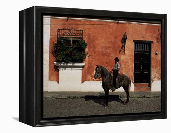 Man on Horse in Front of a Typical Painted Wall, Antigua, Guatemala, Central America-Upperhall-Framed Premier Image Canvas