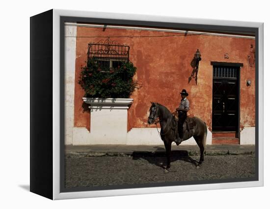 Man on Horse in Front of a Typical Painted Wall, Antigua, Guatemala, Central America-Upperhall-Framed Premier Image Canvas
