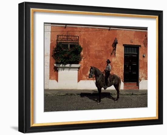 Man on Horse in Front of a Typical Painted Wall, Antigua, Guatemala, Central America-Upperhall-Framed Photographic Print