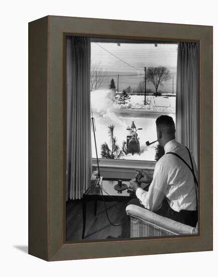 Man Operating Remote Control Snow Plow-Joe Scherschel-Framed Premier Image Canvas