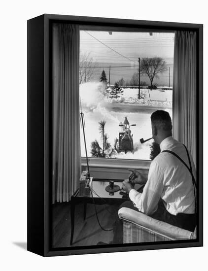 Man Operating Remote Control Snow Plow-Joe Scherschel-Framed Premier Image Canvas