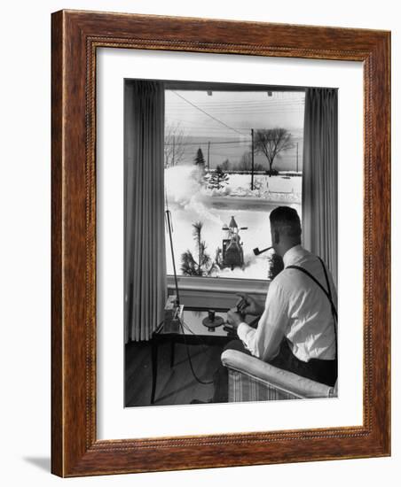 Man Operating Remote Control Snow Plow-Joe Scherschel-Framed Photographic Print