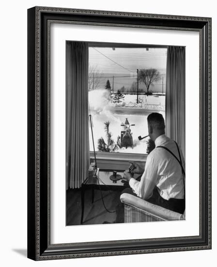 Man Operating Remote Control Snow Plow-Joe Scherschel-Framed Photographic Print