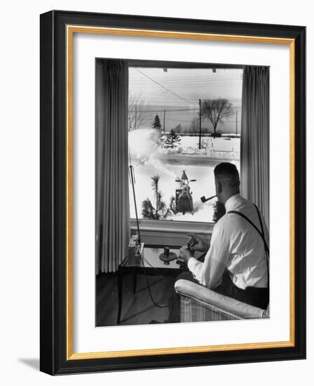 Man Operating Remote Control Snow Plow-Joe Scherschel-Framed Photographic Print