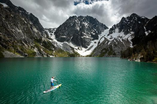 Man Paddle Boards Using Inflatable SUP, Colchuck Lake Alpine ...