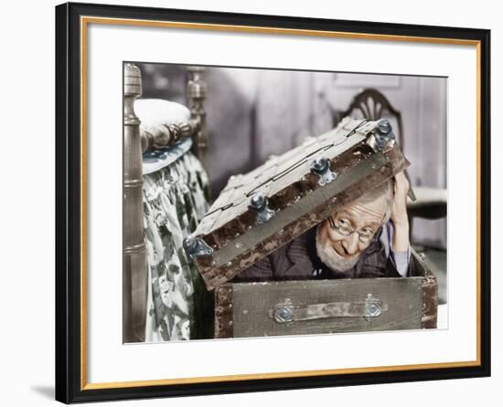 Man Peaking Out of a Trunk-null-Framed Photo